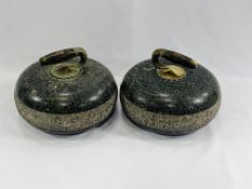 A pair of granite curling stones