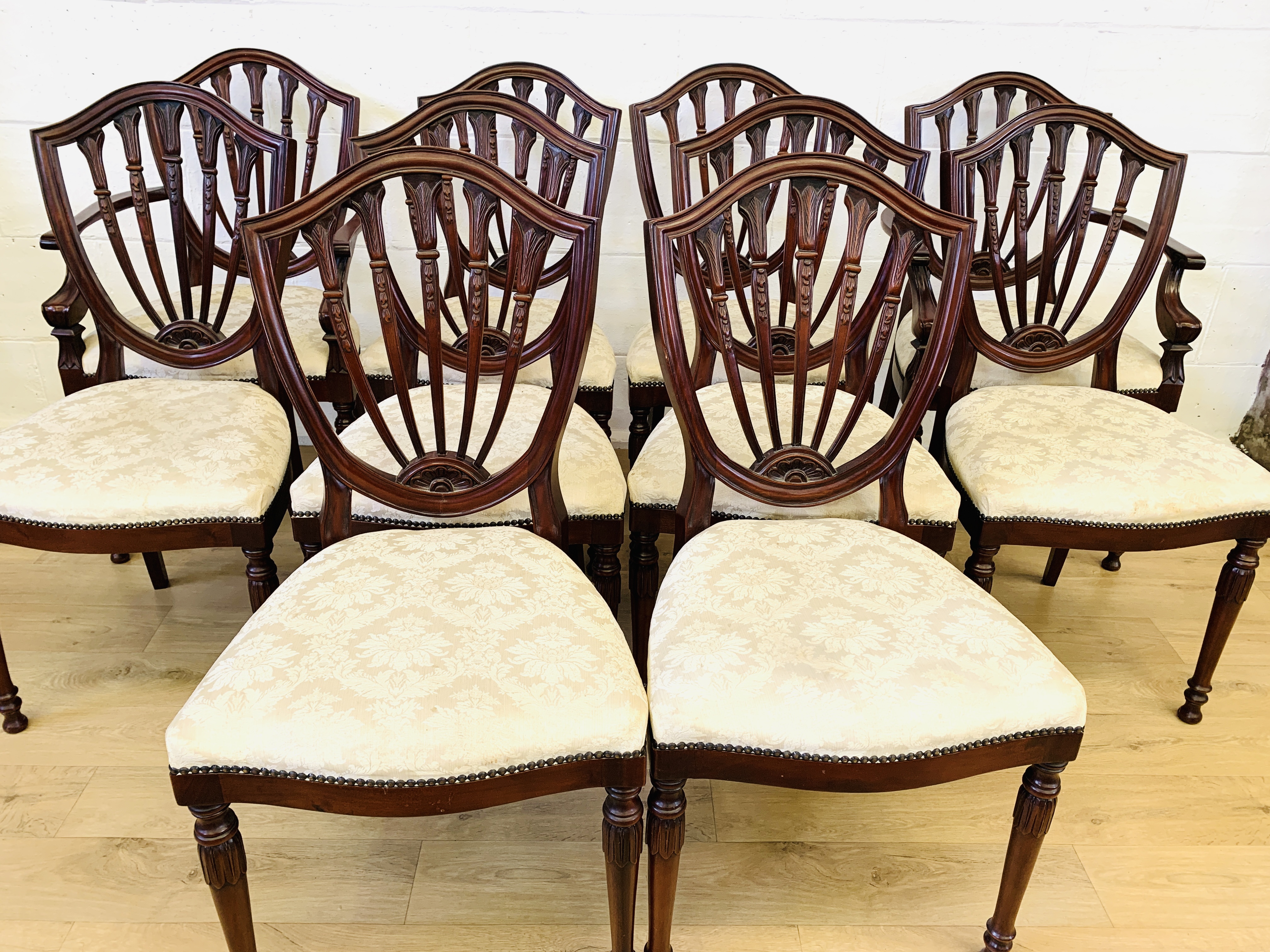 Twelve mahogany dining chairs
