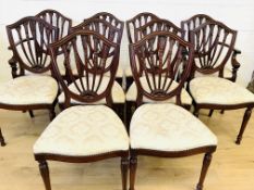 Twelve mahogany dining chairs