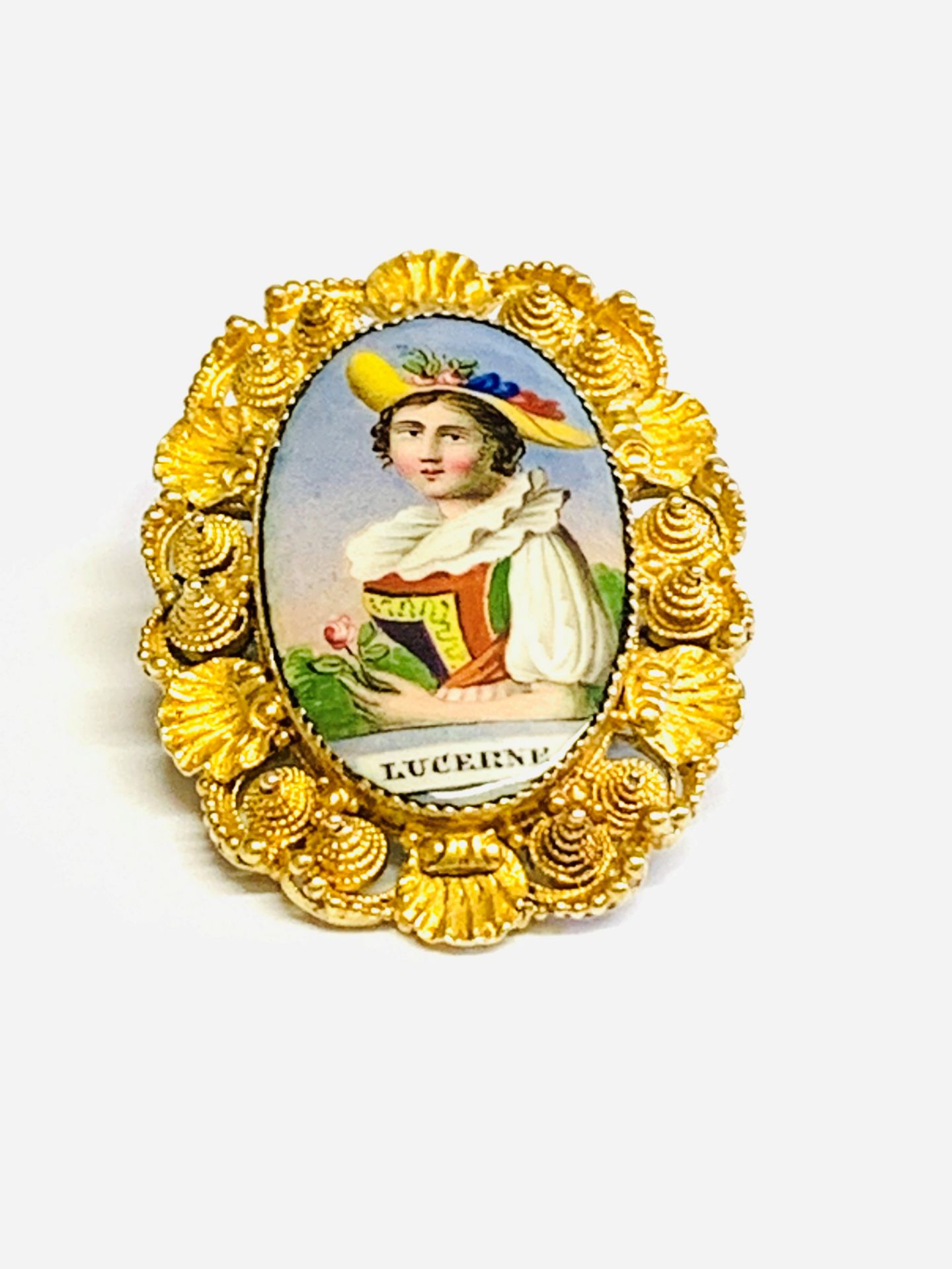Gold brooch with enamel portrait