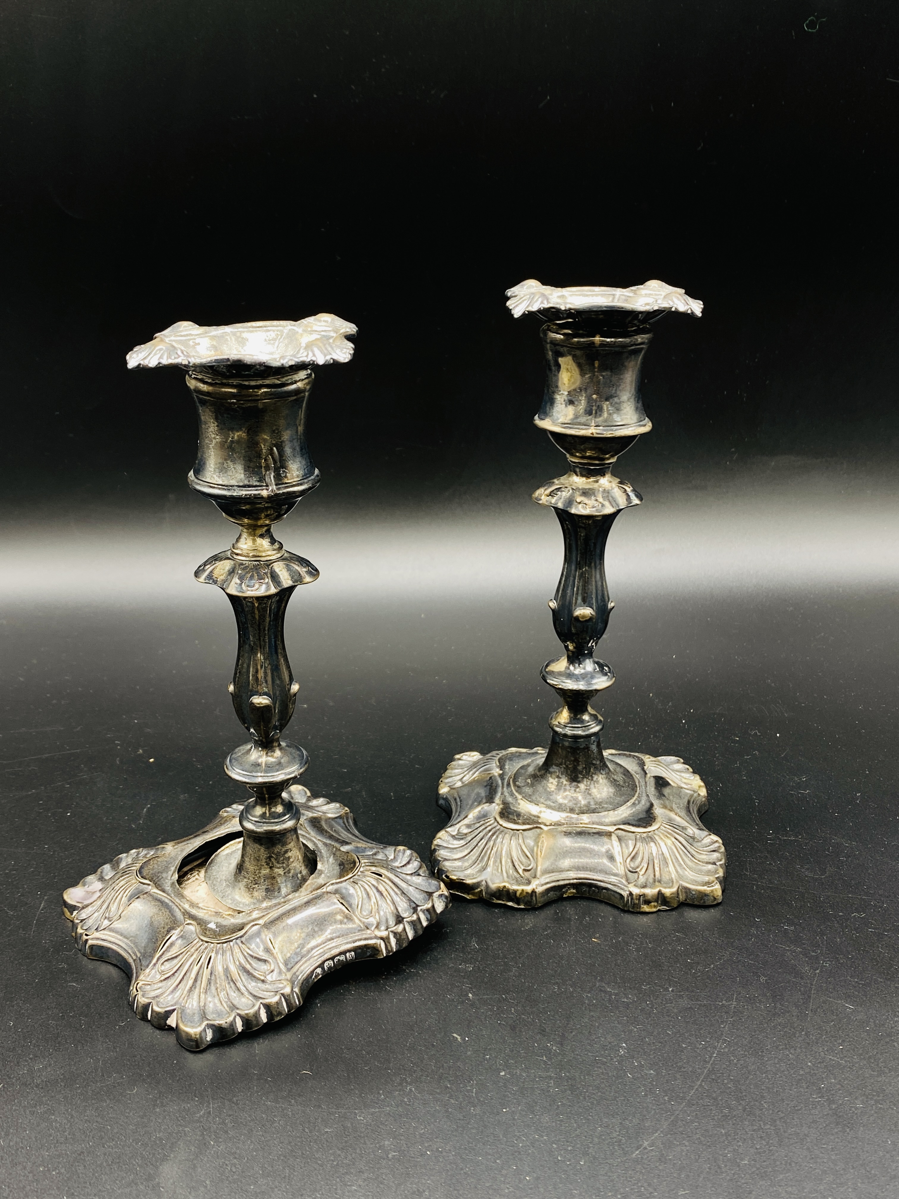 Pair of late Victorian silver candlesticks and a silver four footed epergne