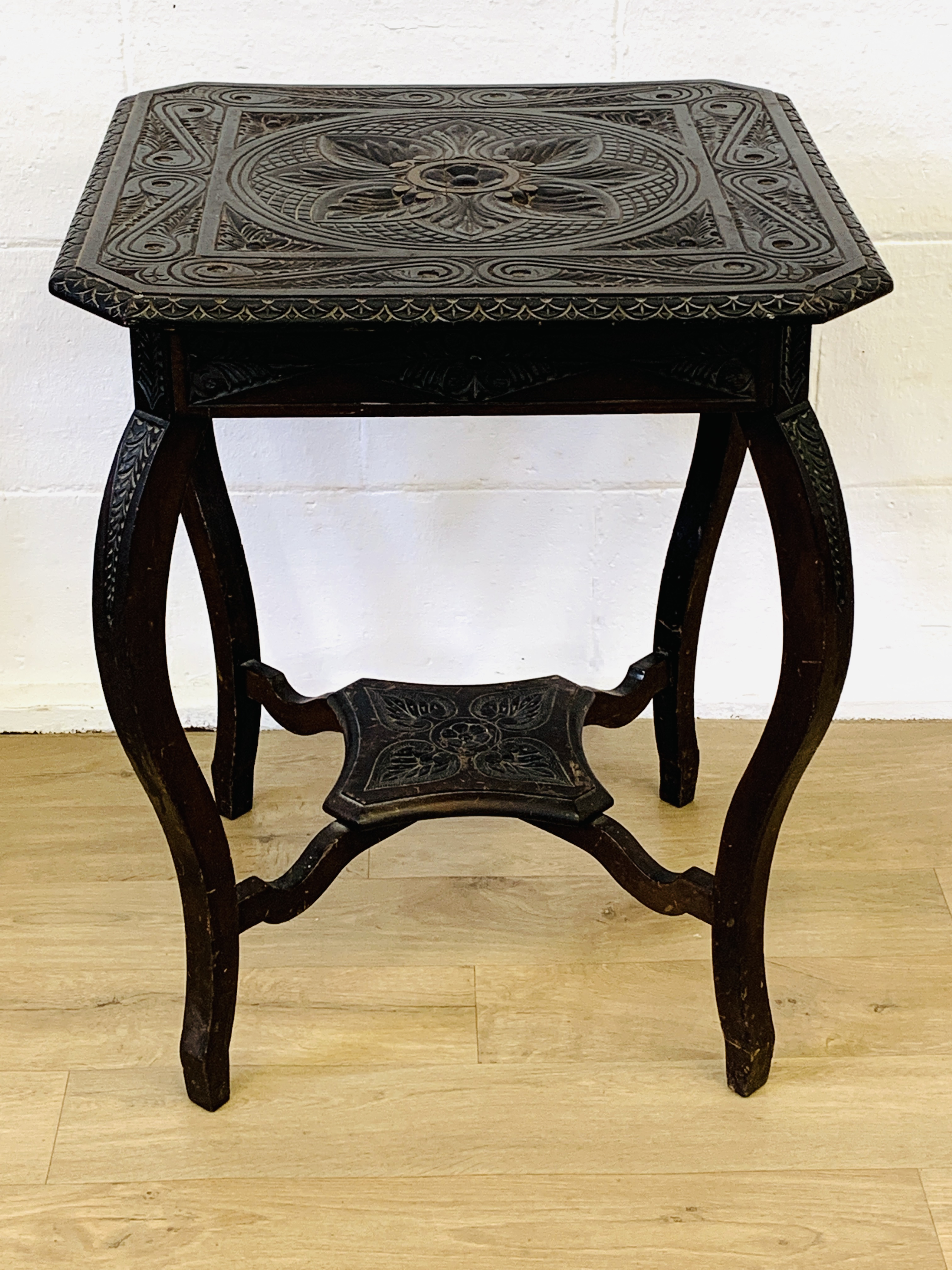 Carved wood display table