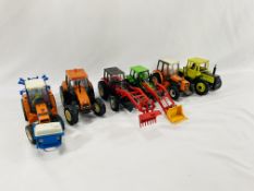 A collection of model tractors and farm machinery