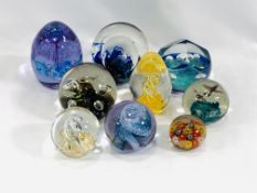 A collection of paperweights