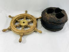 A wooden ships wheel and pulley block