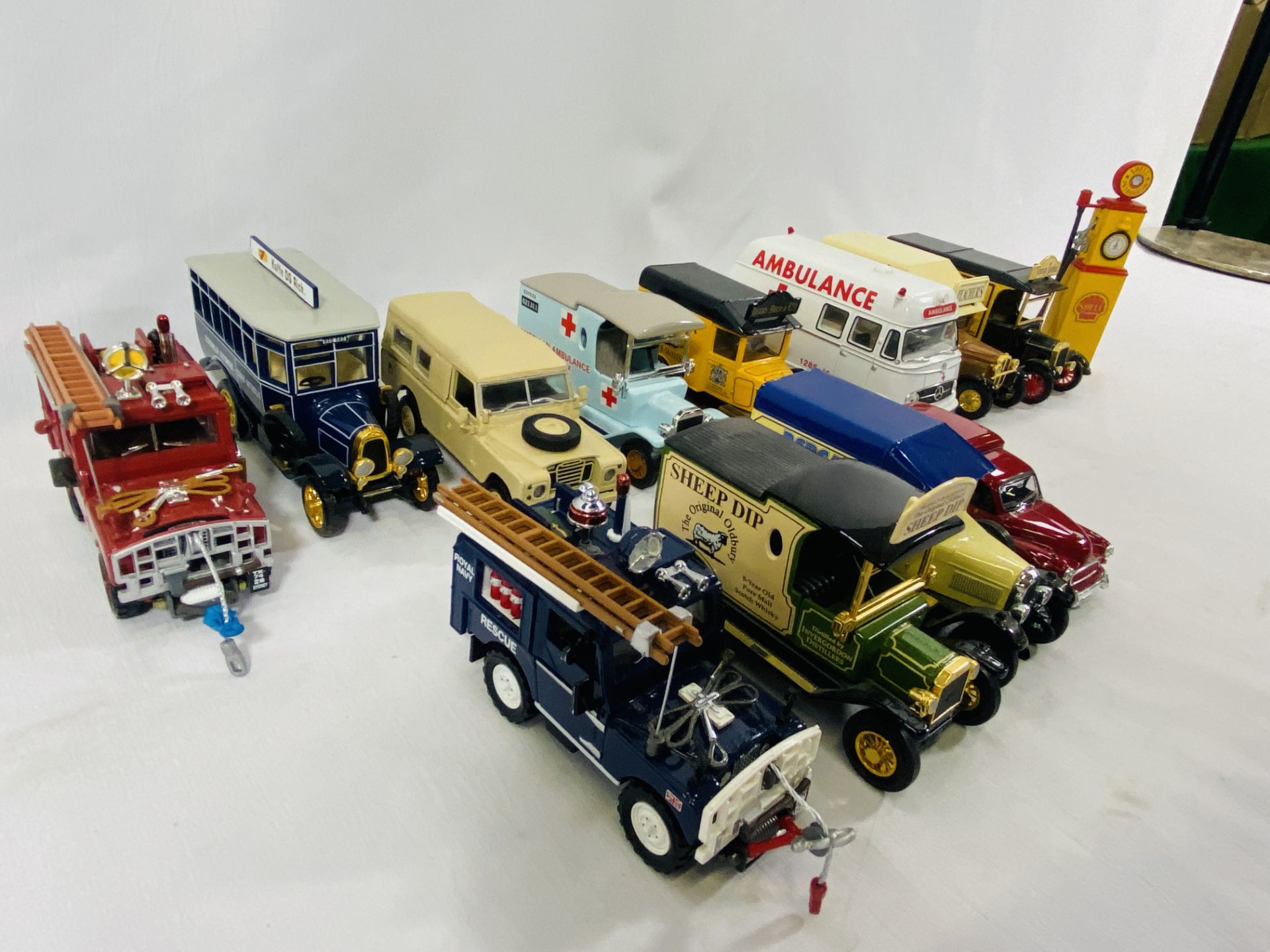 Seven Models of Yesteryear vans with four other model vehicles