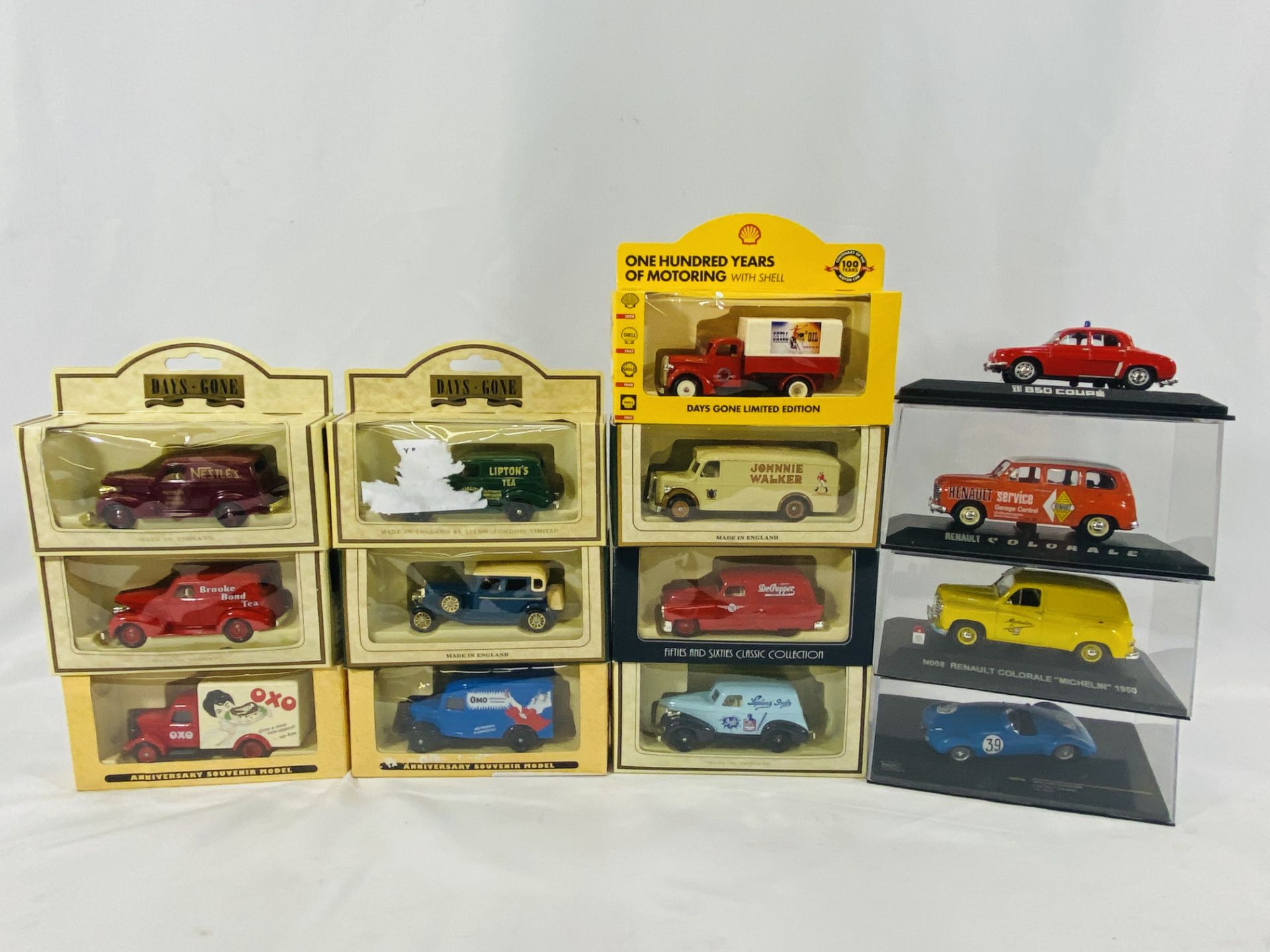 A collection of Days Gone vans together with other model vehicles