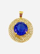 18ct gold pendant set with a colour changing sapphire