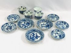 Four Oriental blue and white tea bowls together with eight saucers