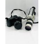 Minolta camera, a Canon camera and accessories