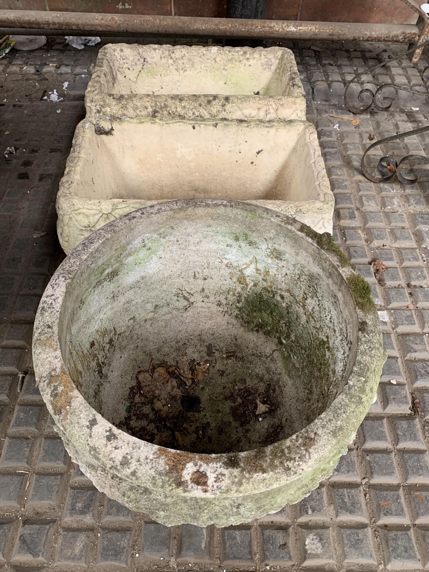 Two concrete troughs and a cast concrete planter