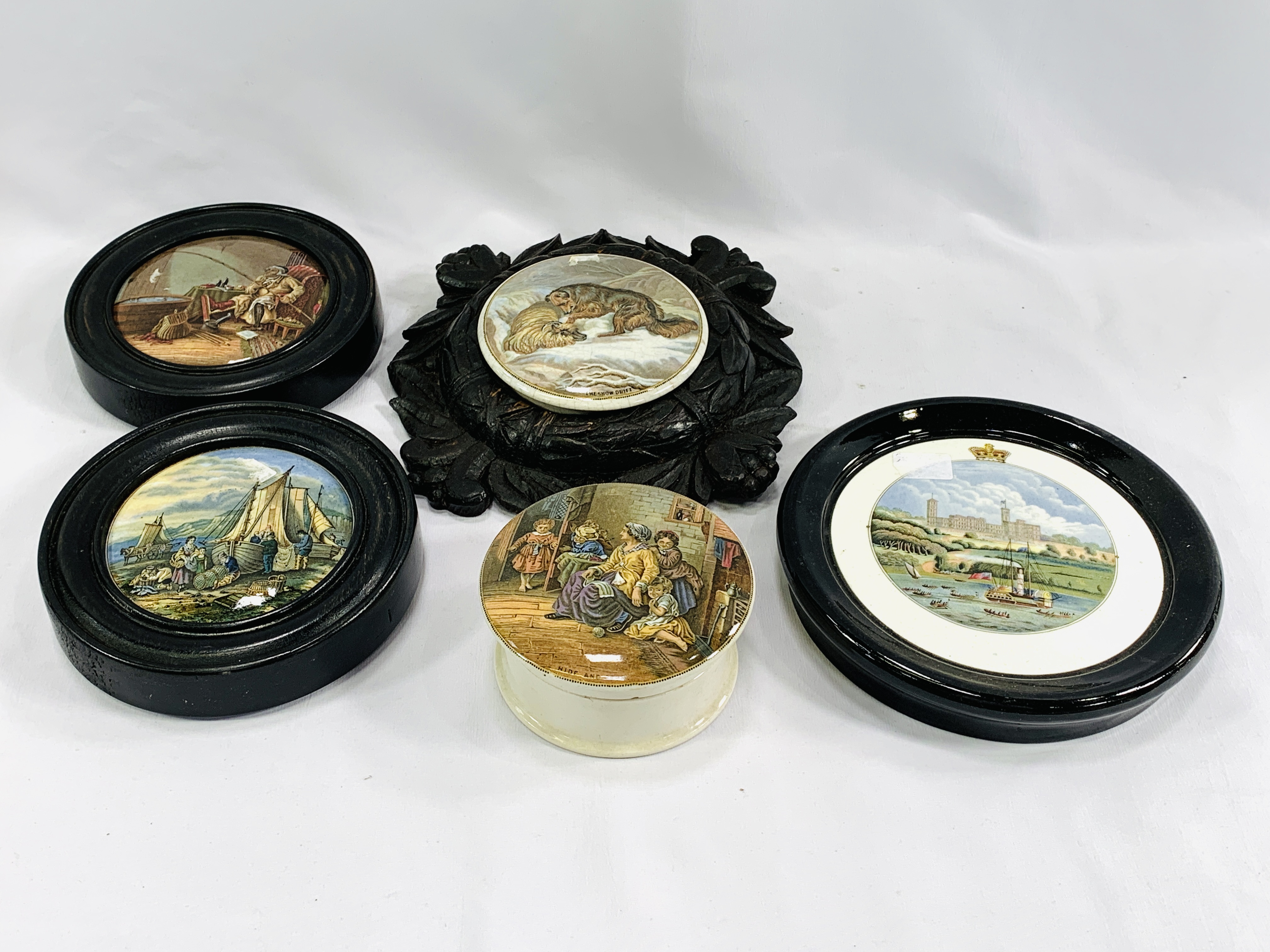 A collection of ceramic pot lids