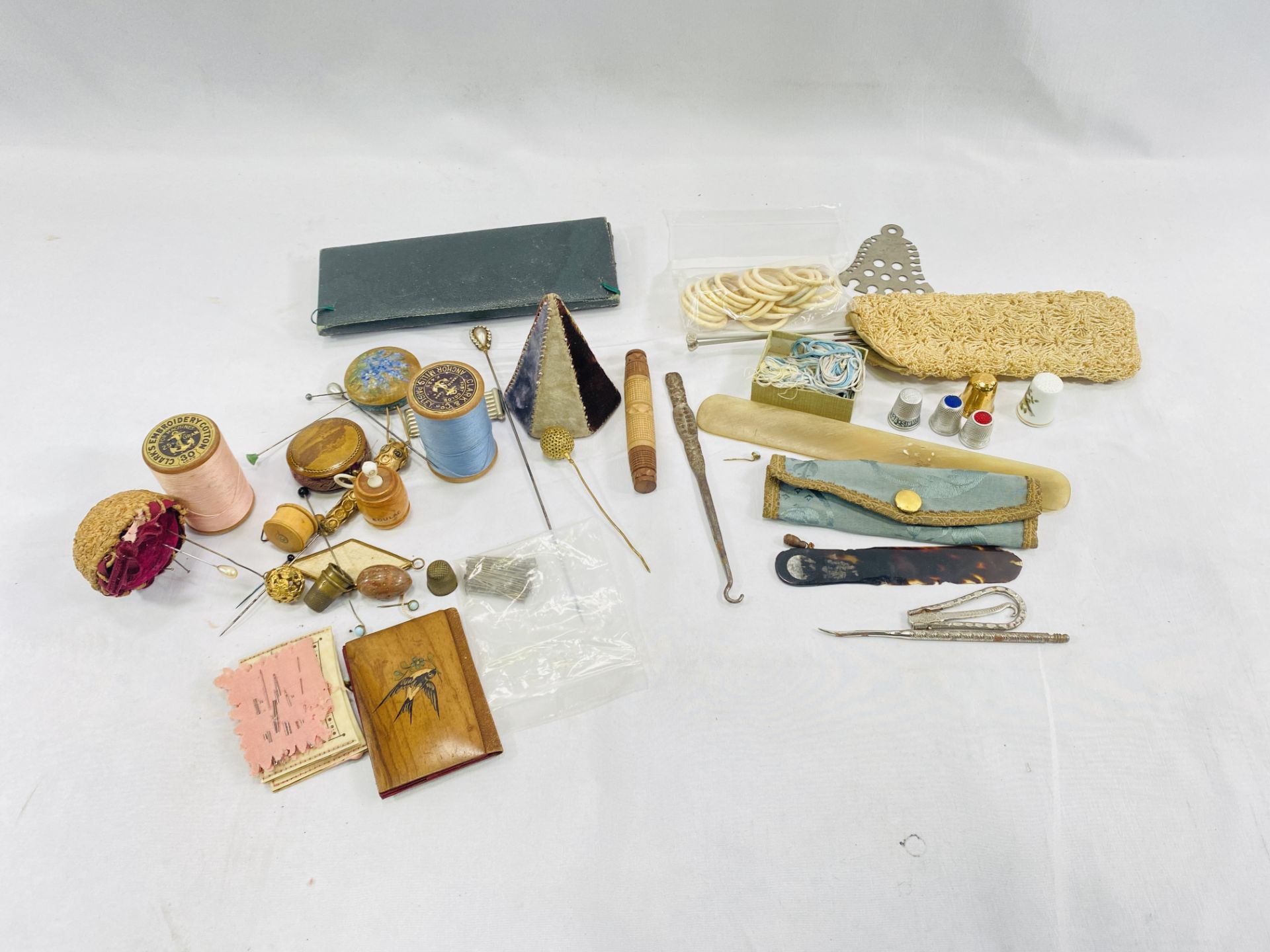 A collection of pin cushions and tape measures