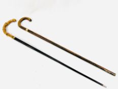 Two walking sticks with 9ct gold plated bands