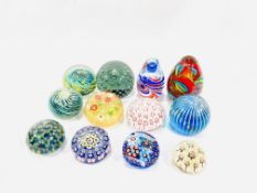 Twelve glass paperweights