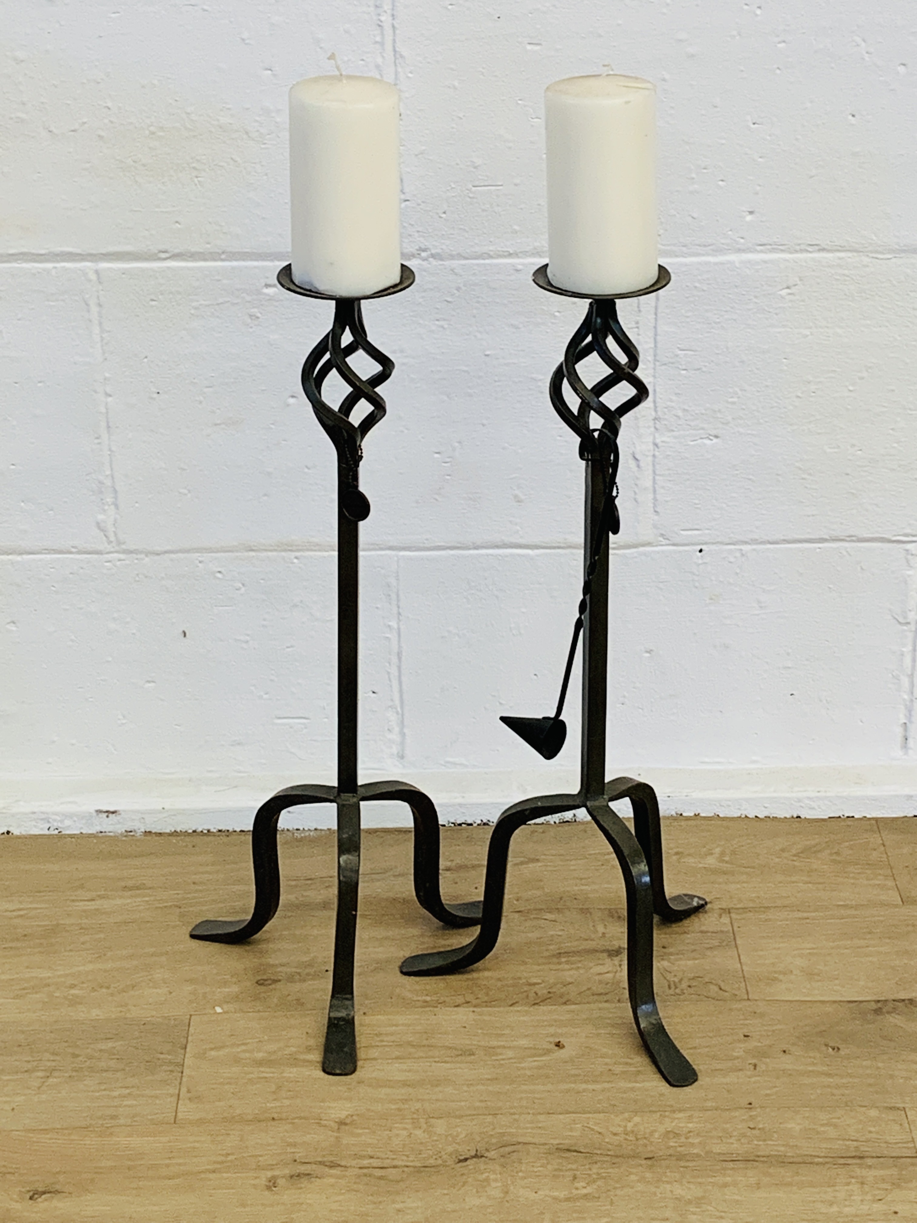 Pair of cast metal candlesticks