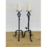 Pair of cast metal candlesticks