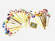 A collection of 24 mostly bone lacemakers bobbins and beads.