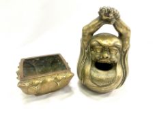 A brass figure together with a brass planter