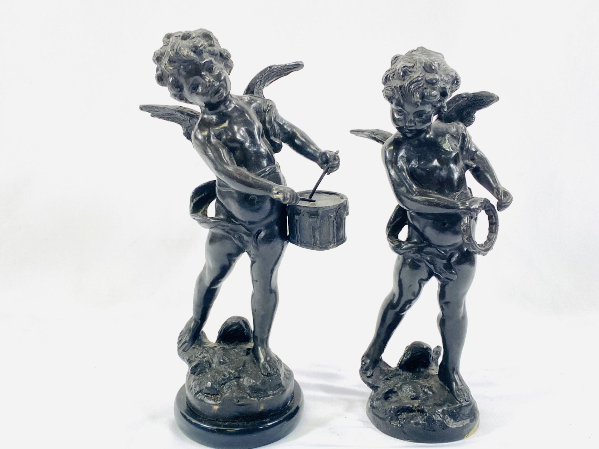 Two brass figures of cherubs