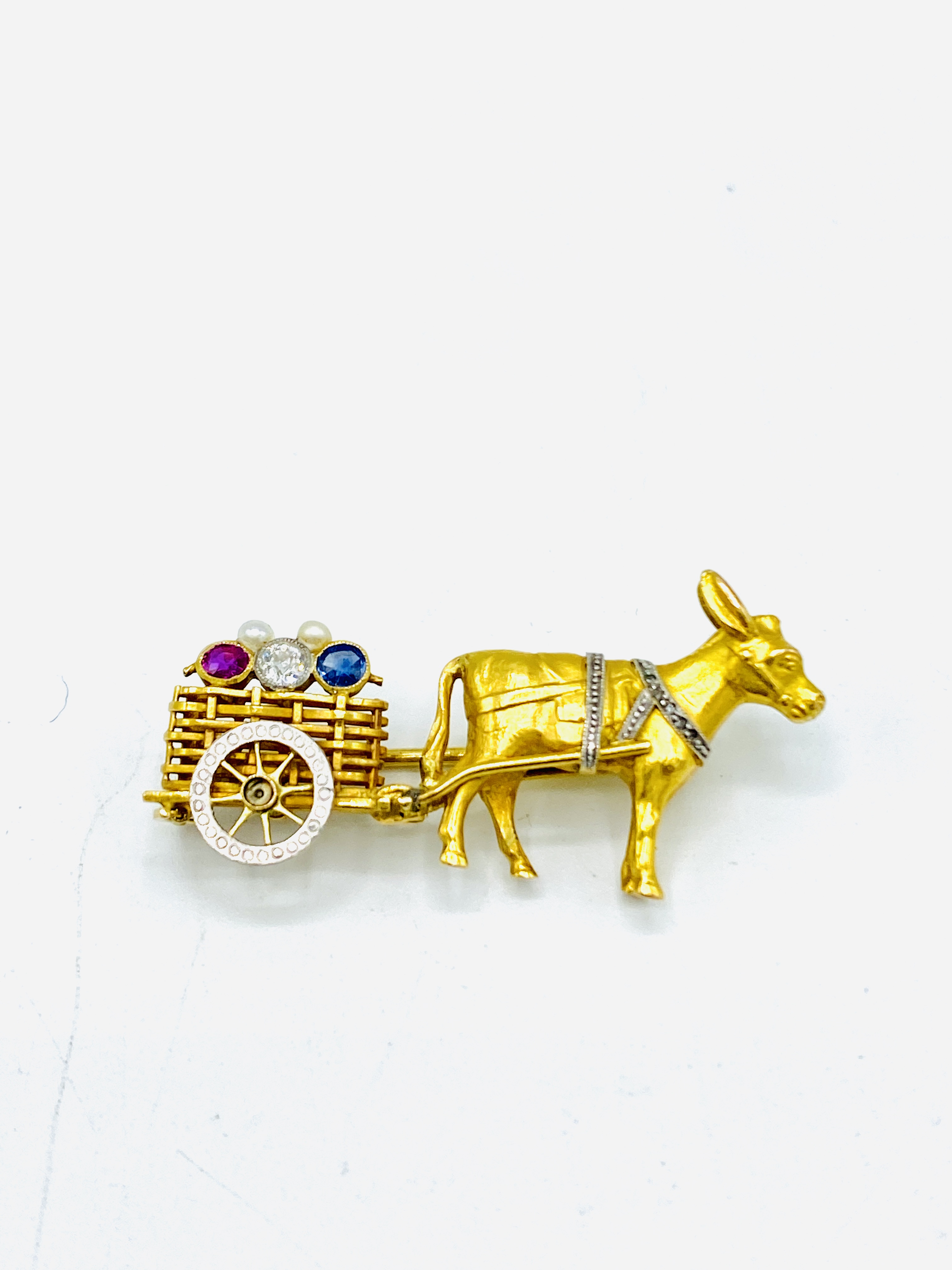 Gem set brooch in the style of a donkey and cart