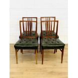 Four teak dining chairs