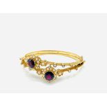 15ct gold bangle set with two garnets and pearls
