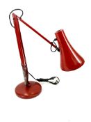 Red anglepoise lamp