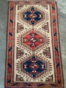 Red wool rug together with a South American style rug
