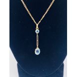9ct gold necklace with aquamarine set pendant