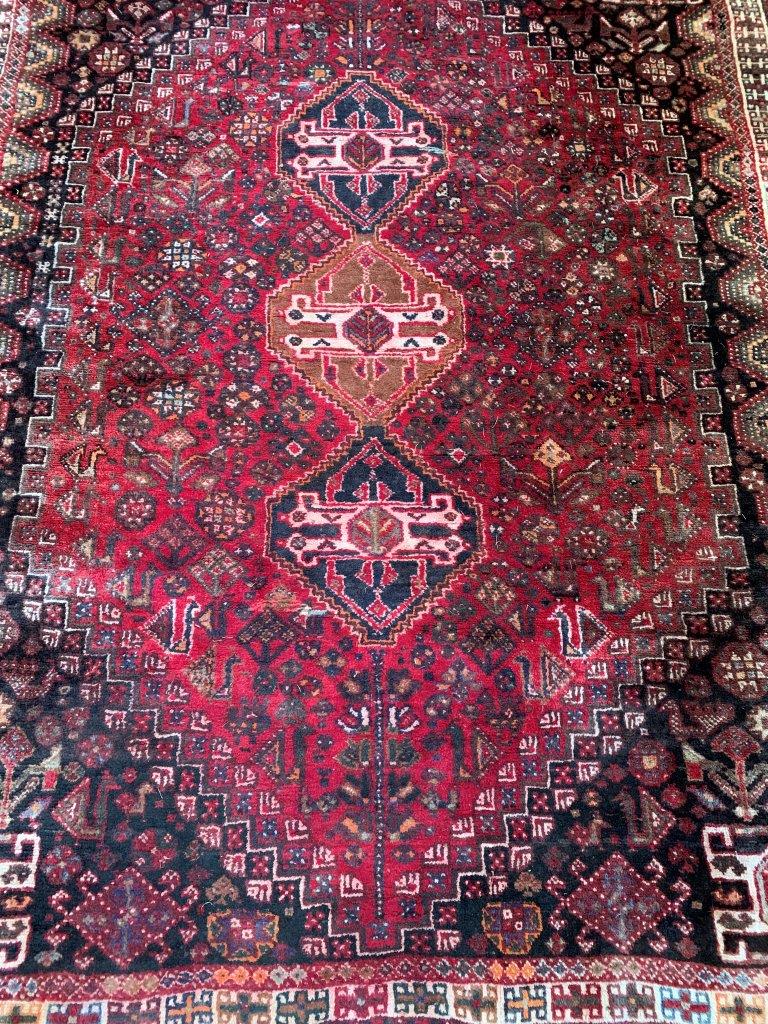 Red ground wool rug