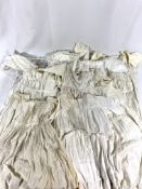 Eleven christening gowns