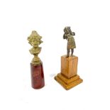 Two metal figures on wooden bases