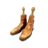 Pair of leather lace up boots with boot trees