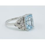 Platinum ring set with an aquamarine and diamonds