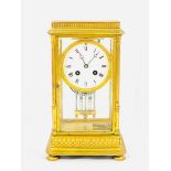 A gilt brass mantel clock