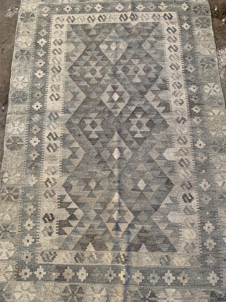 Two grey rugs