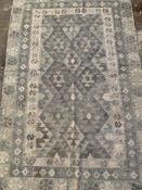 Two grey rugs
