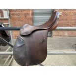 Brown leather Global Saddle Co. saddle 17.5" medium width.