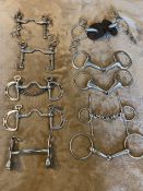 Collection of 10 stainless steel horse bits.