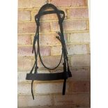 English leather brown bridle. Plain browband and noseband. Full size, new.