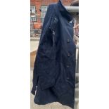 Two ex-Police large black long riding coats, one showerproof by J & S, the other waterproof
