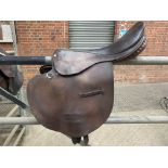 Dark brown leather 17" racehorse exercise saddle by Ideal, stirrup bar clip, three girth straps.