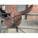 Light tan leather 18" 6lbs Racing saddle, straight stirrup bar, two girth straps, medium width.