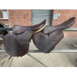 Brown leather 17" Racing saddle and a Barretts of Fakenham 17" racehorse exercise saddle