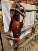 Set of brown trade harness with 22" collar and white metal fittings. This lot carries VAT.