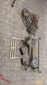 Eleven assorted bits; 5 terrets; brass rein rail and foot rail; pair of stirrups and spurs