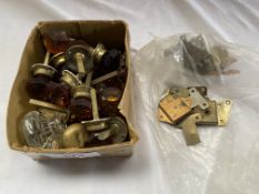 Approx. 30 assorted coloured glass door and drawer knobs some with brass fittings
