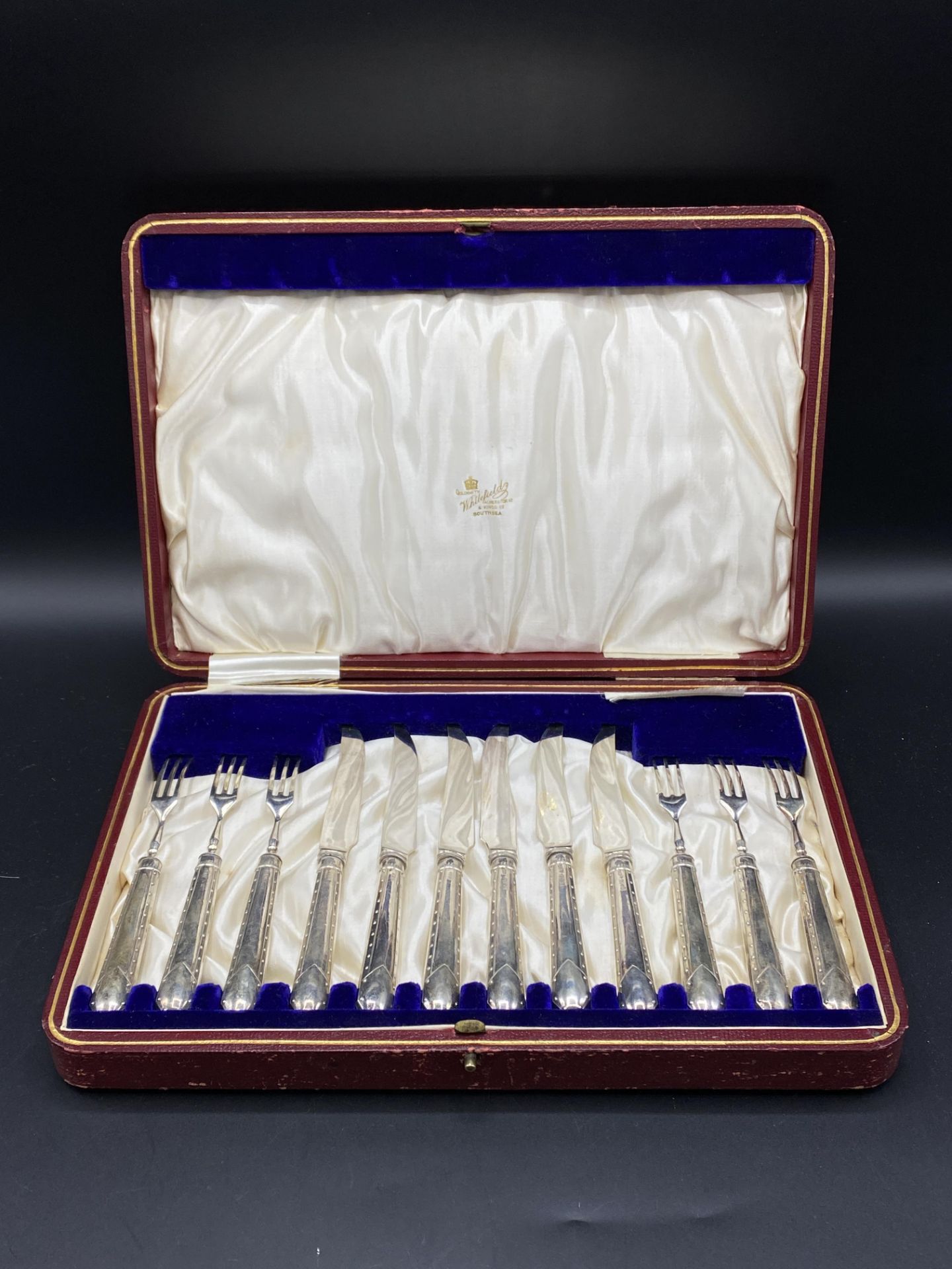 Six knives and forks with silver handles