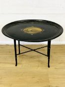 Black lacquer tray on base with bamboo style legs